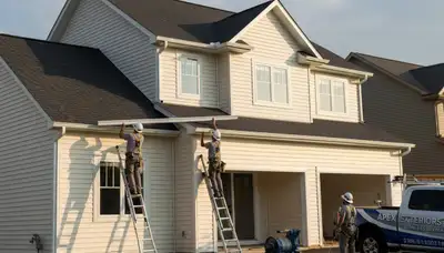 Seamless gutter installation on Brooklyn, NY brownstone by vinyl-siding experts at Next Level Exteriors
