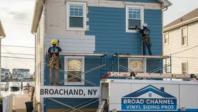 Professional vinyl siding installation on a home exterior in Brooklyn, NY